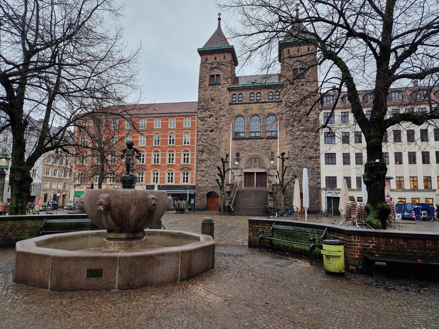 Square with fountain in front and a church in the background.

Fountain: Little Hercules by Rasmus Harboe cirka 1915
Church: Eliaskirken (1908)